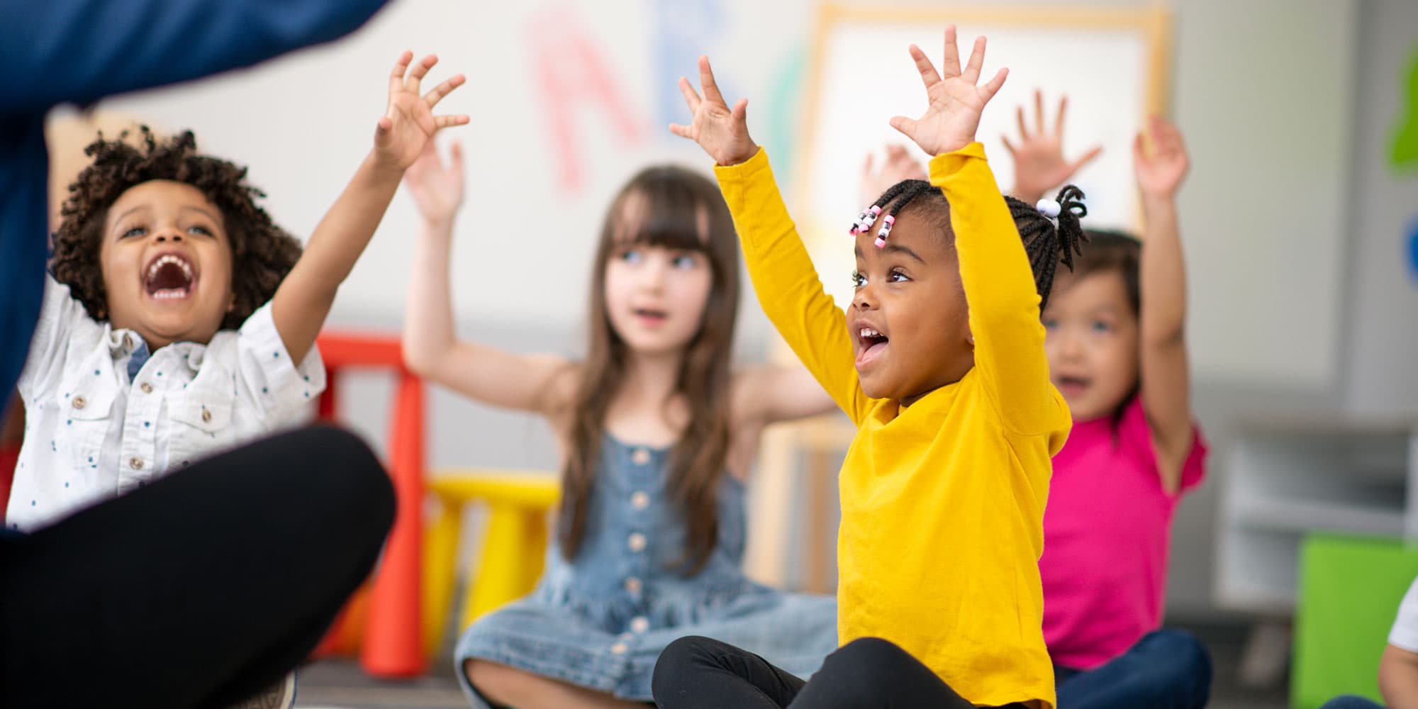 Students learning together in a bright classroom